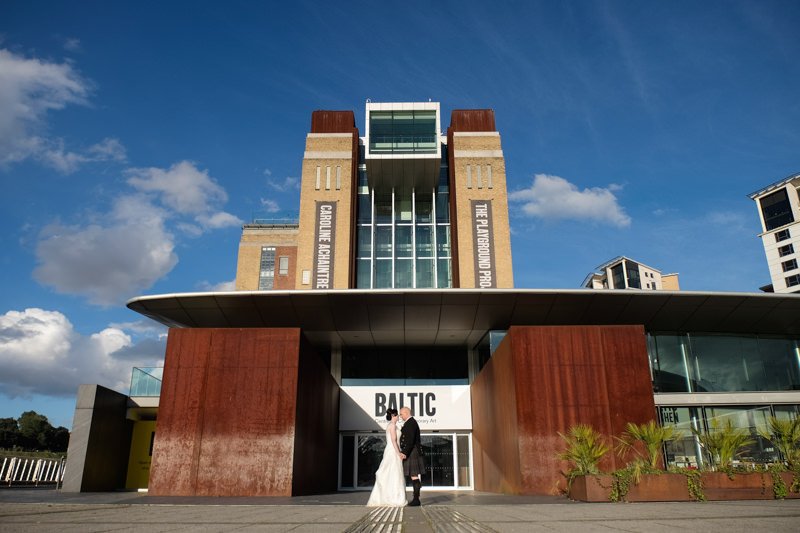 couple in front of baltic
