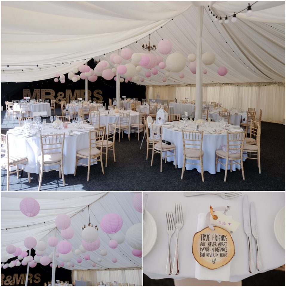 A wedding reception with pink and white balloons hanging from the ceiling, perfect for a stunning wedding photograph.