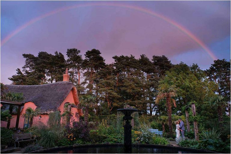 Bride & Groom under rainbow