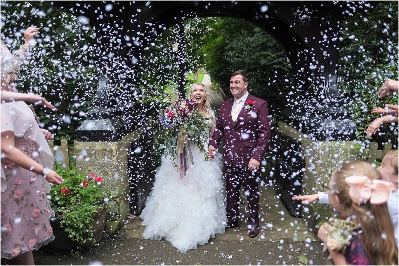 bride and groom with confetti