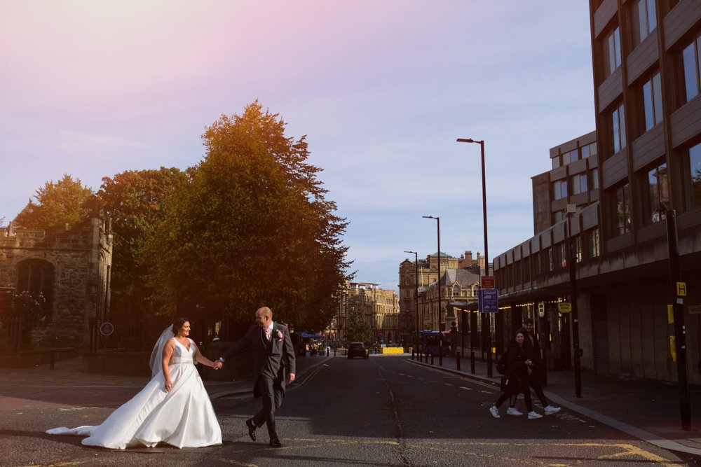 couple walking over street